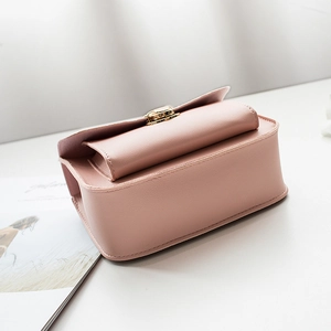 Minimalist light pink PU leather crossbody bag with elegant gold metal cylinder lock