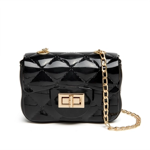 Mini black quilted jelly crossbody bag with gold chain strap and twist lock closure