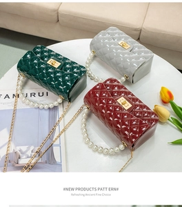 Close-up of mini quilted jelly bags with elegant pearl handles and gold chain straps