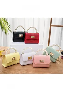 Detailed display of mini jelly bags with pearl handles and crocodile texture in six colors