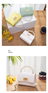 Detail of mini crocodile pattern jelly bags with pearl handles and metal buckles