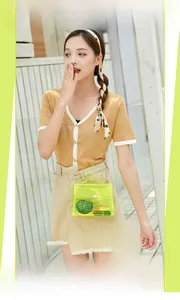 Neon green transparent jelly bag featuring a gold metal lock and elegant chain strap
