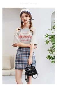 Glossy black patent leather mini handbag with sport ribbon strap and lettering details