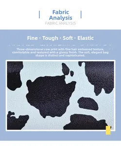 Close-up of cow print leather texture showing detailed embossed hair grain and glossy finish