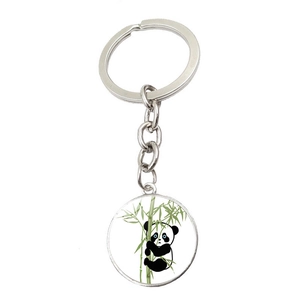 Cute cartoon panda climbing green bamboo on a round silver metal keychain pendant