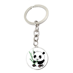 Detailed view of a round panda keychain featuring a cute panda eating bamboo