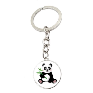 Detailed view of silver metal keychain with cute cartoon panda eating bamboo print