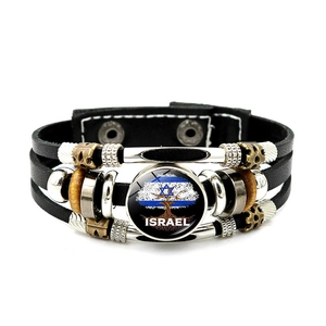 Detail of multi-layer leather bracelet with Israel flag and Tree of Life glass cabochon charm