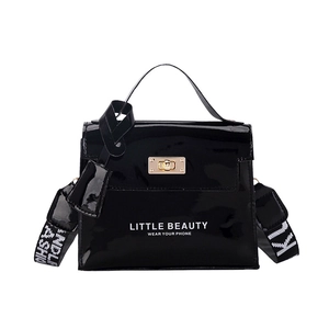 Glossy black patent leather handbag with gold twist lock and lettered crossbody strap