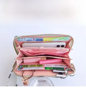 Internal view of mint green long wallet showing large capacity and multiple card slots