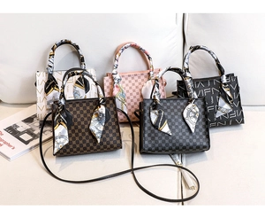 Selection of printed leather handbags with silk scarves in five different colors