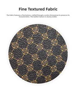 Detailed view of the synthetic leather fabric with golden clover pattern and litchi texture