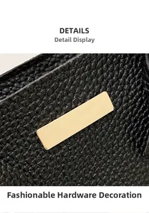 Close-up of premium gold metal hardware on black lychee grain leather handbag