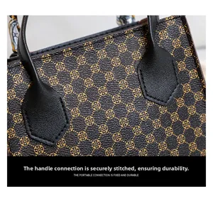 Close-up of durable reinforced stitching on the leather handle of the printed tote bag