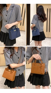 Close-up of pebble leather texture and golden hardware on dark blue and brown handbags