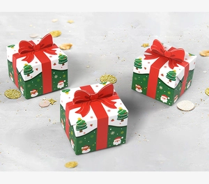 Detail of Christmas gift boxes with red bows, reindeer and Santa Claus cartoon patterns