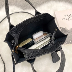 Litchi texture black handbag with organized interior storage and zip compartment