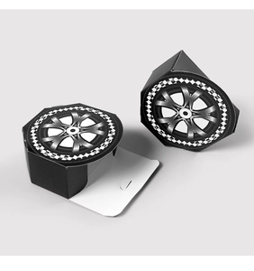 Detailed view of hexagonal racing gift boxes with tire rim prints and checkered flag edges