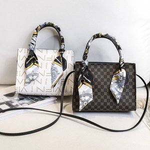 Chic tote-style crossbody bags with logo prints and elegant decorative silk scarves