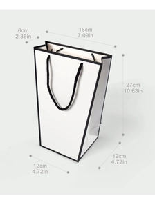 Detailed dimensions of a white trapezoid paper gift bag with black edges and rope handles