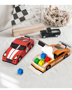 Detailed view of red and orange racing car shaped gift boxes for kids birthday parties