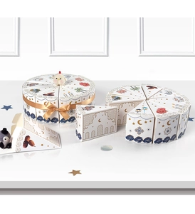 Macro view of white triangle cake gift boxes with golden Eid moon and star patterns