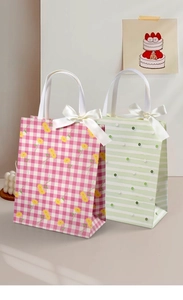 Detail of vintage textured gift bags with daisy patterns and elegant ribbon bows