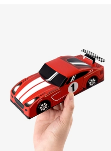 Close-up of a red race car shaped paper gift box with racing stripes and number one
