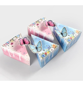 Macro detail of triangle cake-shaped gift boxes with floral prints and 3D butterfly decor