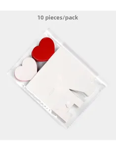 Flat lay of 10-piece DIY candy box set with 3D red heart cards in transparent packaging