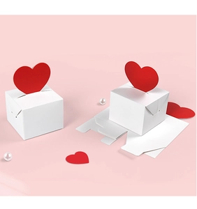 Macro detail of white square gift box with 3D red heart-shaped clasp for Valentine candy