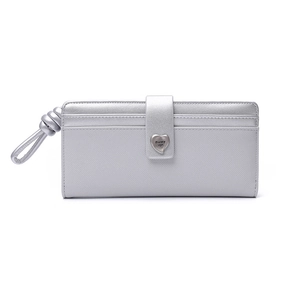 Close-up of textured silver wallet featuring a heart-shaped buckle and wrist strap