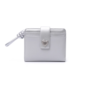 Detail of silver Saffiano leather wallet featuring a heart-shaped buckle and wrist strap