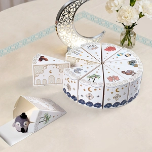 Triangle cake-shaped Eid Mubarak favor boxes with star moon and mosque prints for sweets
