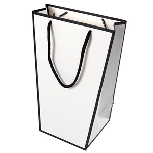 Minimalist white trapezoid gift bag with black border and rope handle for packaging