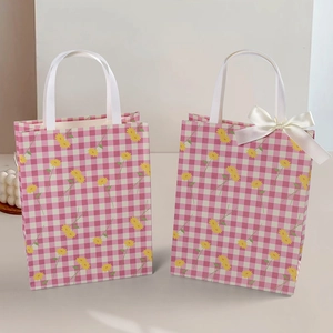 Elegant vintage textured paper gift bag with yellow daisy plaid pattern and satin bow