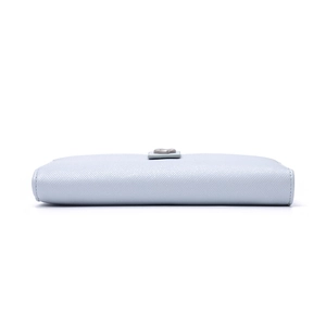 Detail view of light blue Saffiano leather wallet with silver heart metal buckle clasp