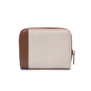 Detail of bicolored mini wallet featuring light beige woven texture and brown leather trim