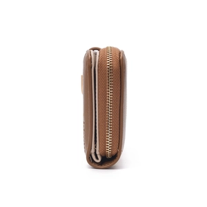 Side view of brown leather wallet showing metal zipper detail and thick storage space