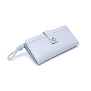 Detail of light blue faux leather long wallet featuring a heart-shaped metal buckle and strap