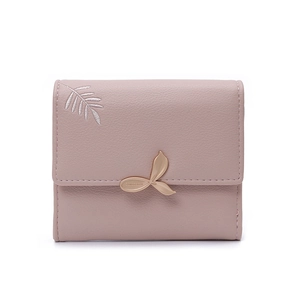 Detail of trifold pink PU leather wallet featuring leaf embroidery and golden buckle