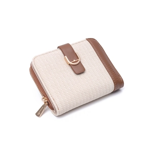 Close-up of beige woven texture and brown leather strap with golden snap on wallet