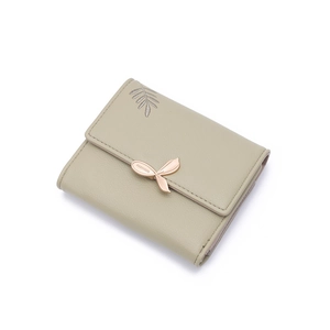 Detail of sage green matte PU leather wallet featuring rose gold leaf buckle and embroidery
