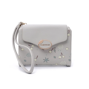 Detail view of grey PU leather wallet with floral print and golden leaf buckle