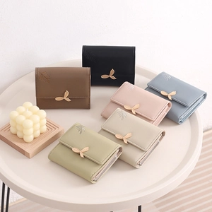 Minimalist short tri-fold women's PU leather wallet with elegant gold leaf buckle detail