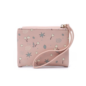 Detailed view of pink floral print mini purse with zipper and detachable wrist strap