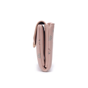 Side view of pink PU leather tri-fold wallet showing stitching and abstract dot pattern