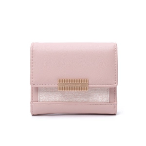 Close-up of pink litchi grain leather and tweed texture on a tri-fold wallet with gold buckle