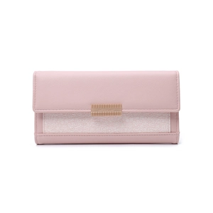 Detail of pink long wallet with litchi grain leather and gold metal buckle engraving