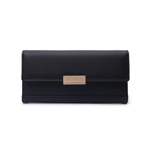 Detail of black pebbled leather wallet featuring a rectangular gold vertical stripe metal buckle